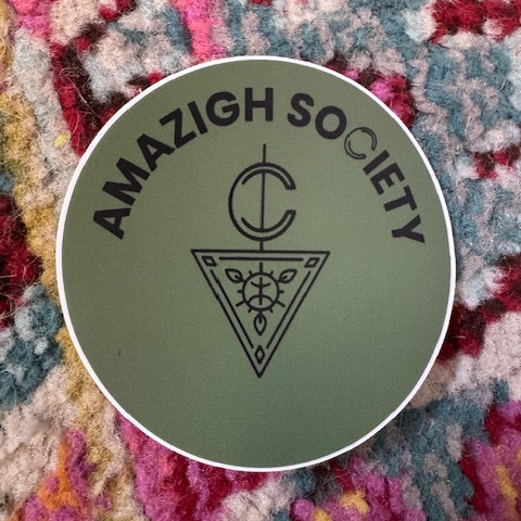 Logo of the Amazigh Society on a textured fabric background